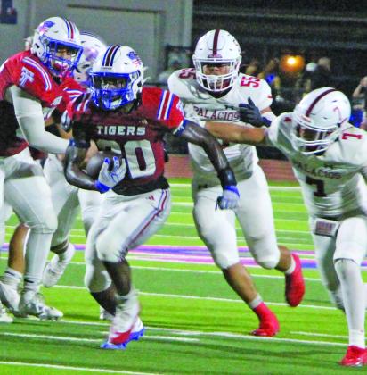 Sentinel Photo/Jessica Shepard Tiger running back Noah Riddick barrels through Palacios defenders. Riddick was Tidehaven’s leading rusher with 149 yards on 11 carries and two touchdowns.