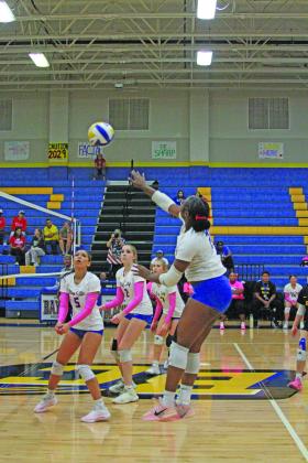 Photo by Anna Hernandez Lady Cat 21 Kimya Lewis hits the ball back over the net for Bay City to keep the ball in play against Brazosport Friday night. 