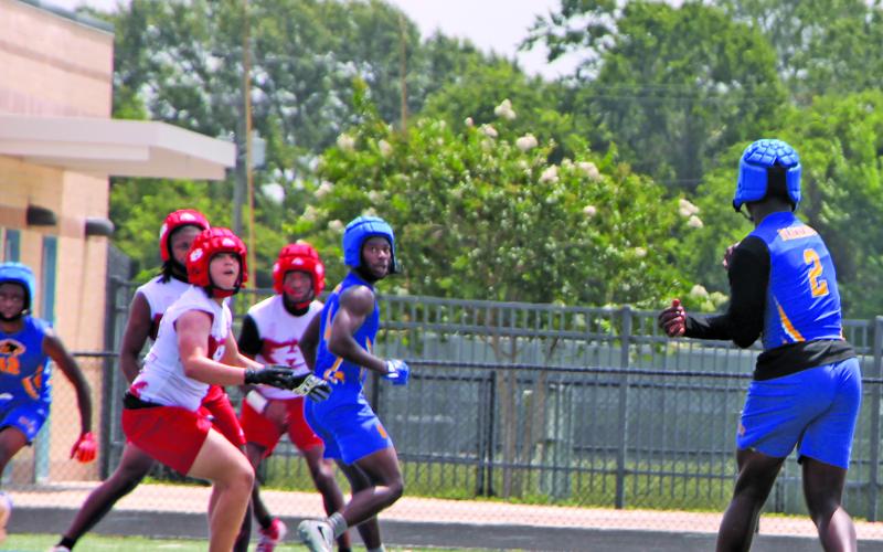 Sentinel Photo/Mike Reddell A Bay City quarterback finds an open receiver in 7on7 action last week at Memorial Stadium.