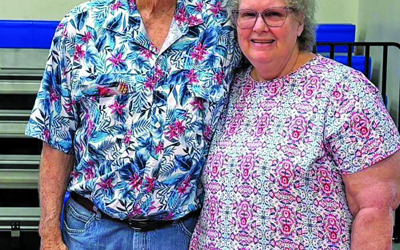 Contributed  photo The Tidehaven community honored Coach Robert Hutto, shown with his wife Nancy, with a retirement celebration at the Tidehaven Dome Saturday, June 6, Hutto was recognized for his 52 years at Tidehaven ISD and 54 years in coaching and teaching. Family, friends, former students, players and community members gathered for the celebration.