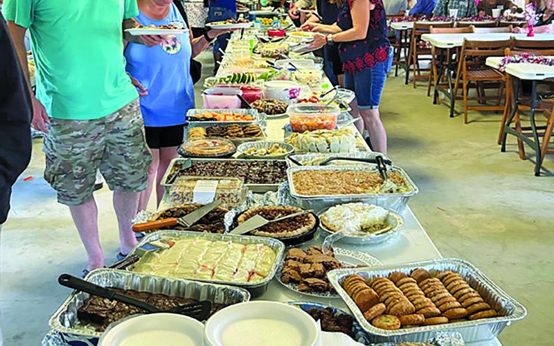 Family and friends celebrated Collegeport’s 118th Year Saturday, May 30. Food is always plentiful at Collegeport Day and last weekend was no exception. In addition, Fellowship, historical items from early day Collegeport all are part of this reunion. Photo at left courtesy  of Reese Busby