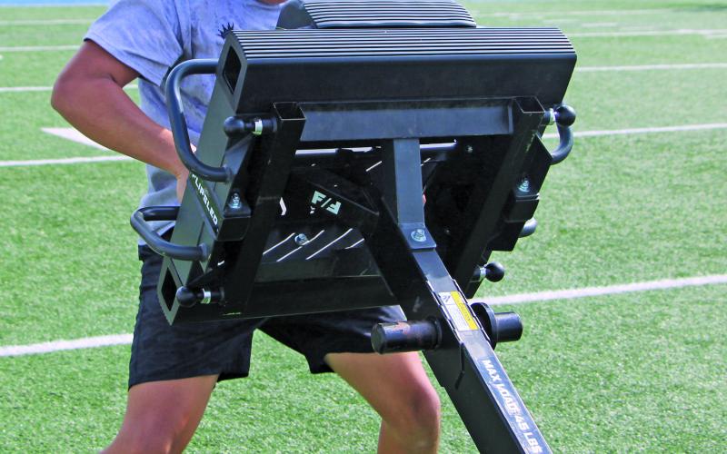 Sentinel Photo/Mike Reddell A Bay City Blackcat wrestles a lift downfield as another measure of upper and lower body strength.