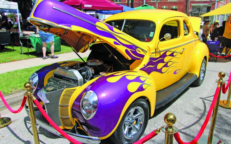 Sentinel Photo/Mike Reddell Hotel Blessing Day drew an impressive crowd Saturday, July 18, with a car show, music, vendors, food and the historic hotel itself. Above is this classic hot rod, a 1940 Ford coupe, which was one of many cars on display.