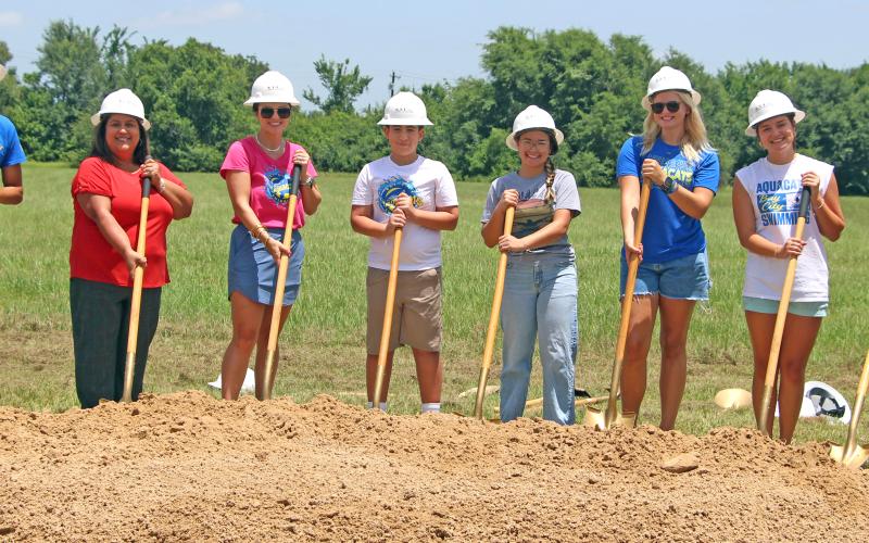 Sentinel Photo/Jessica Shepard Aquacats parents and players turned dirt as part of “The Aquatics Center of Matagorda County” groundbreaking ceremony Monday, July 20. Several other entities and groups posed for pictures at the ceremony as well.