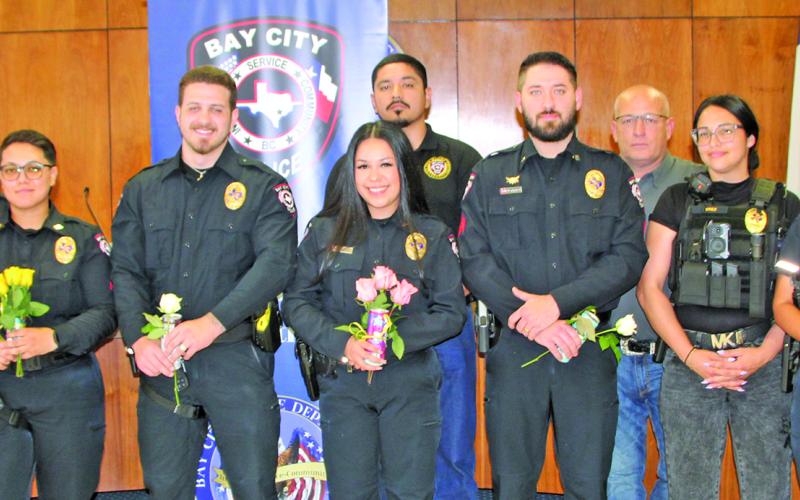 Sentinel Photo/Mike Reddell  Newly promoted officers are joined by other BCPD officers.