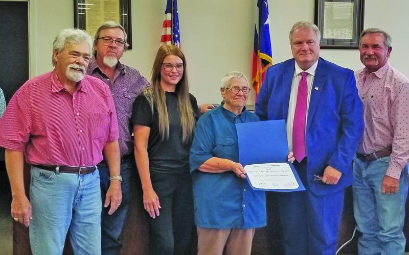 Sentinel Photo Commissioners Court accepted Texas Historical Commission’s Distinguished Service Award for Matagorda County Historical Commission at the court’s meeting Monday. MCHC member Edith Crower (center) shows off the state’s recognition. MCHC members Mike Reddell, second from left, and Kristi Lee also took part, with court members Commissioner Bubba Cook, Commissioner Bubba Frick, County Judge Bobby Seiferman, Commissioner Troy Shemek, and Commissioner Mike Estlinbaum.