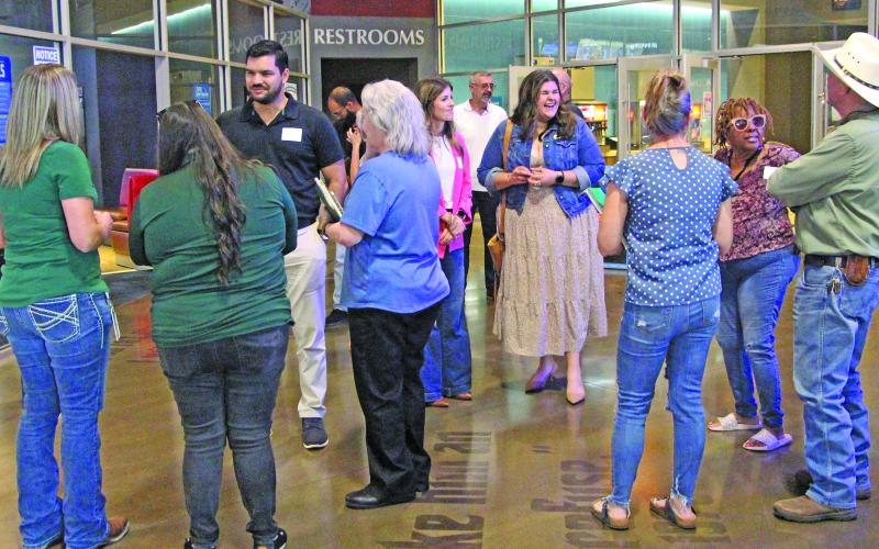 Sentinel Photo/Jessica Shepard Several business professionals take the time to network before Lynn Engineering's "How to Never Fail a Windstorm Inspection" luncheon on Wednesday, July 1.