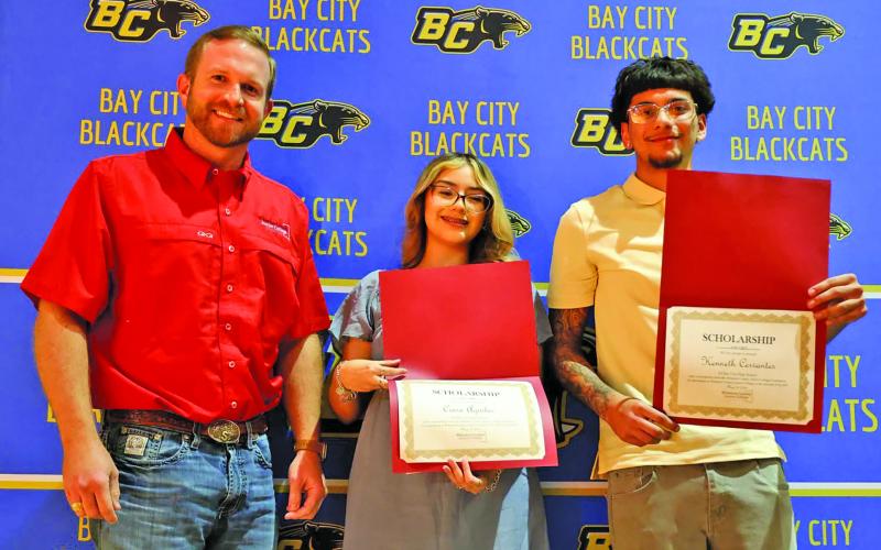Scott Savage, WCJC Foundation Board Member, with Bay City High School graduates Ciara Aguilar and Kenneth Cervantes