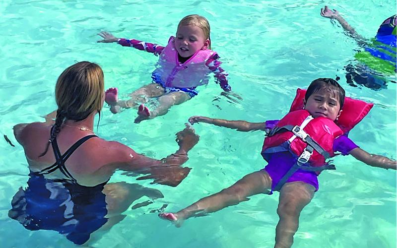 Phillips 66 photo YMCA Bay City members participate in swim safety demonstration at 16th Street Pool.