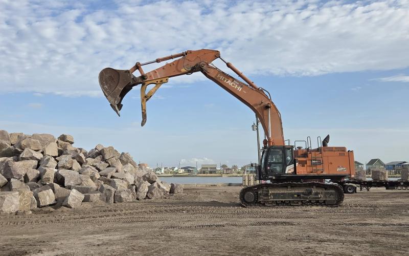 JP 6 Constable Bill Orton photo Precinct 6 Constable Bill Orton posted this photo of the excavator at a giant pile of granite that will be used for the breakwater project at Sargent Beach.