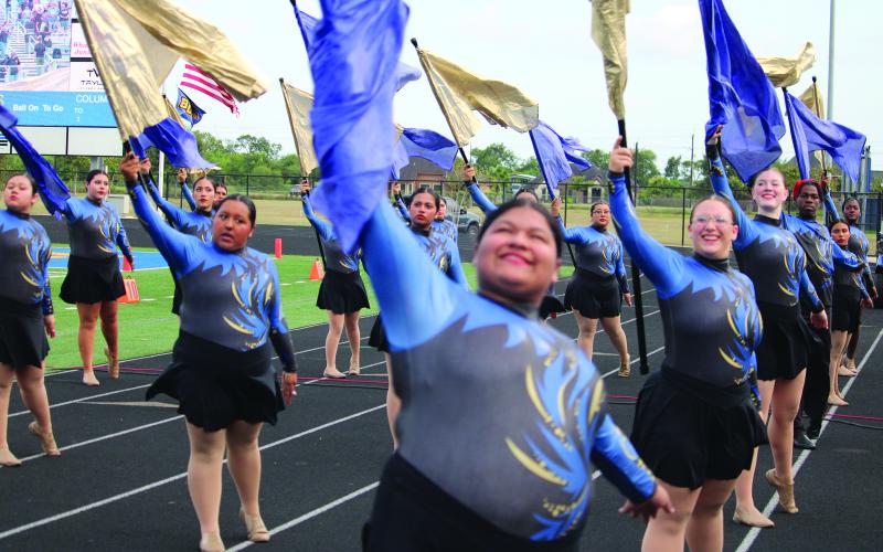 Members of the BCHS Color Guard rehearse their routines Friday evening, before the Bay City Blackcat - La Marque Cougar football game. Sentinel photo/ Mike Reddell