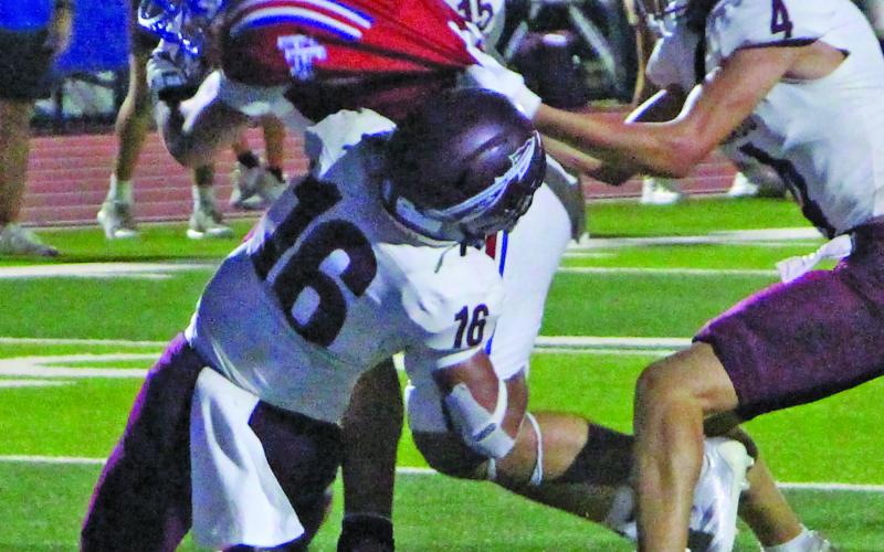 Sentinel Photo/Jessica Shepard Below, the Tiger quarterback forces his way to a touchdown.