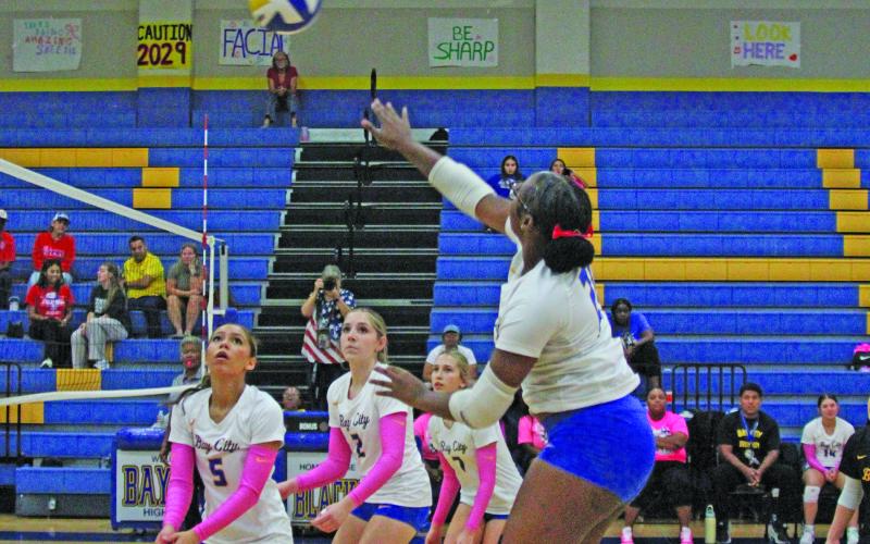 Photo by Anna Hernandez Lady Cat 21 Kimya Lewis hits the ball back over the net for Bay City to keep the ball in play against Brazosport Friday night.