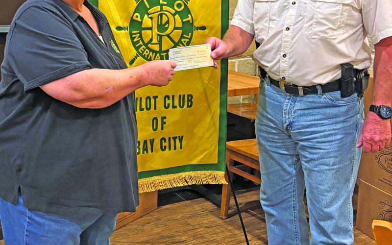 Pilot Club of Bay City President Barbara Smith presented Precinct 6 Constable Bill Orton, a check for boating safety signs at a recent Pilot Club meeting. This donation covers the signs and installation, providing safety guidelines for boaters at all Sargent area boat ramps. We encourage all boaters to take a picture of the sign so they have the information on hand if needed. This project was funded by the Pilot Club Celebrity Waiter Dinner Fundraiser, which will be held on Thursday, Oct. 15. Courtesy photo