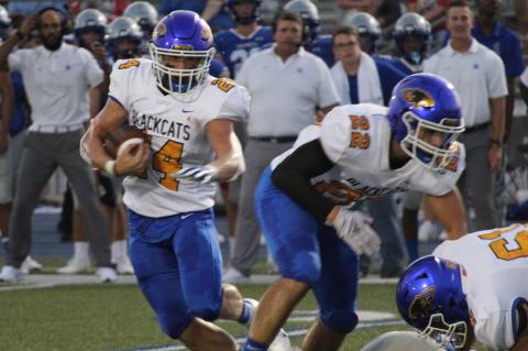 Sentinel file photo Blackcat junior running back Ayden Smith (24) works his way through defenders.