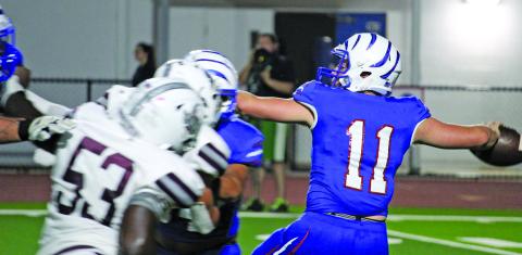 Tidehaven quaterback Logan Crow (11) prepares to throw in last Friday’s game with Industrial. Sentinel photo/Mike Reddell