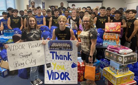 BCISD photo City of Vidor Mayor Misty Songe, at right, helped deliver a truckload of goods to the Blackcat football team Monday morning.