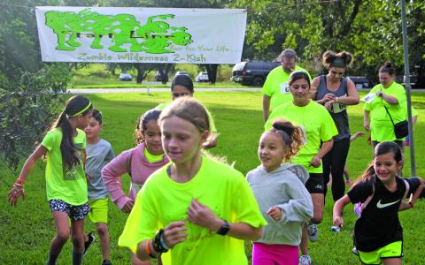 Sentinel photo/Mike Reddell Zombies of all ages begin this year’s Zombie Run at Riverside Park, Saturday, Oct. 23. The were prizes for different zombie and runner categories in the city sponsored event.