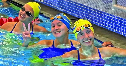 Photo/Shelby Luder Bay City swimmers, from left, Lucy Frick, Victoria Sliva and Megan Moya in a happy moment at Rosenberg meet. The three won first in the Girls 200 Yard Freestyle Relay at Rosenberg.