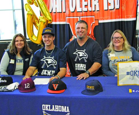 Sentinel photo/Mike Reddell Van Vleck High School baseball player Gunner Gibbens, second from left, signed with Oklahoma Wesleyan University in ceremonies Nov. 10, at the high school. Taking part in the ceremony were, from left: Gunner’s mother, Nell Gibbens; Gunner; his father, David Gibbens; and his sister, Karen Gibbens.