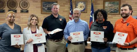 Sentinel photo/Jessica Shepard Van Vleck ISD recognized several staff members for their lifesaving efforts on a junior high student earlier this month. They were awarded the American Heart Association Heartsaver Hero and Top Leopard awards. Those employees are, from left: Gwen Franklin, Lyndee Owen, Michael Polachek, Jeff Jacques, Cassandra Higgins, Will Dowell, and not pictured: Darius Williams.