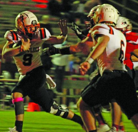 Sentinel photo/Jessica Shepard Van Vleck running back Sam Brooks (9) pushes back at Brazos defenders en route to a touchdown. 