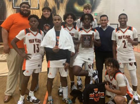 Contributed photo Leopard players and coaches show off tournament championship trophy..