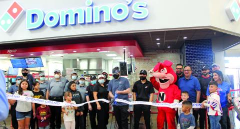 Sentinel photo/Jessica Shepard The Bay City Chamber of Commerce celebrated a ribbon-cutting ceremony with Domino's Pizza Saturday, Nov. 20. The pizzeria is located inside Walmart at 4600 Seventh Street in Bay City and delivers to Van Vleck residents.