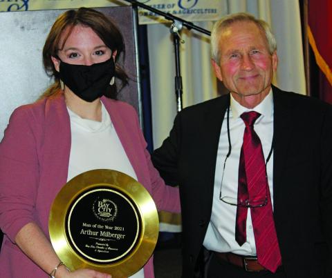 Sentinel photo/Jessica Shepard Arthur Milberger, above left, with Chamber Board Chairman Amanda Sitka received the Bay City Chamber of Commerce and Agriculture’s Man of the Year award at the chamber’s annual banquet Thursday, Jan. 20. Patsy Anderson, above right with Sitka, received the chamber’s Woman of the Year honor. 