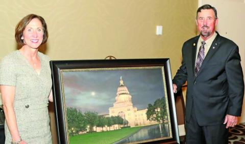 Contributed photo Senator Kolkhorst is presented the S.M. True Agricultural Champion Award from TFB President Russell Boening