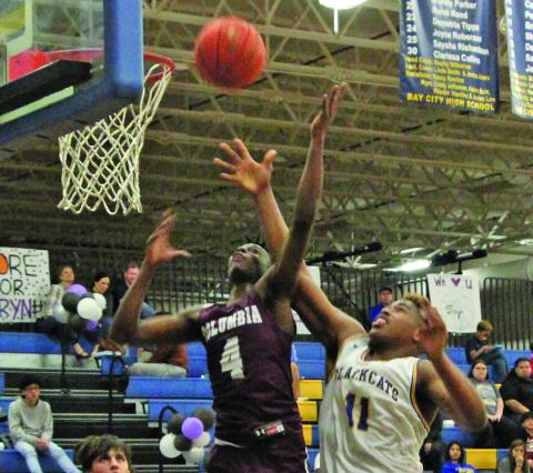 Sentinel photo/Mike Reddell Blackcat sophomore Carlon Jones (11) goes for a layup against a Columbia defender in Bay City’s 61-48 win over the Roughnecks here Feb. 1.