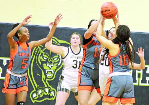 Photo/Anna Hernandez Van Vleck’s Jaila Williams (15) and Carlysia Gibson (10) box in a Danbury player I. Schraven (20) during last week’s game that the Leps (16-11, 5-6) won 37-34. Van Vleck is fourth in district.