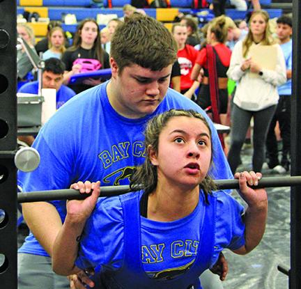 Sentinel photo/Mike Reddell Bay City High School Powerlifter Alexis Alvarez takes on the standing press at the Regional Powerlifting Tournament at BCHS last week..