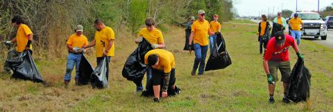 Sentinel photo/Mike Reddell Bay City Boy Scout Troop 45 joined by adult troop leaders picked up debris along FM 2668 near the Matagorda County Fairgrounds on Friday, March 4, during the 2022 fair.