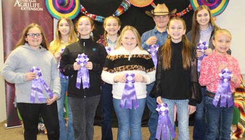 Sentinel photos/Jessica Shepard Matagorda County Fair and Livestock Association's Home Economics food entry winners received purple rosettes for their win as Grand Champions of their chosen divisions Saturday, Feb. 26. Winners include Marleigh Wendell, Camille Hutson, Taelynn Tinnin, Abigail Jurek, Jacob Oncken, Aribella Carson, Makayla Alford, Kali Claxton, Cheryl Saha, Jace Reynolds, Beatriz Valle, Shawn Sneath, Lacy Smith, Hunter Ryman, Emily Rodgers, and Ava Bowers. 
