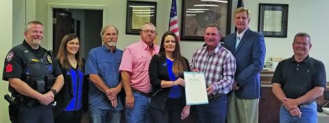 Sentinel photo/Mike Reddell Matagorda County Commissioners Court declared the month of April as Sexual Assault Awareness & Child Abuse Awareness and Prevention Month at the court’s meeting Monday. Shown, from left, are: Chris Hadash and Brittany Matthews, both with The Crisis Center, Precinct 1 Commissioner Bubba Cook, Precinct 4 Bubba Frick, Kelli Wright Nelson, with The Crisis Center, Precinct 3 Commissioner Troy Shimek, County Judge Nate McDonald, and Precinct 2 Commissioner Kent Pollard.
