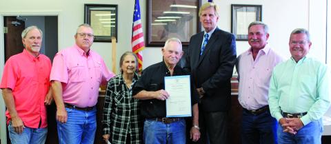 Sentinel photo/Jessica Shepard Soil and Water Conservation board member Billy Mann and his wife Linda, center, were joined by commissioners when receiving a proclamation naming the week of April 24 to May 1 as “Soil & Water Stewardship Week” Monday, April 18.