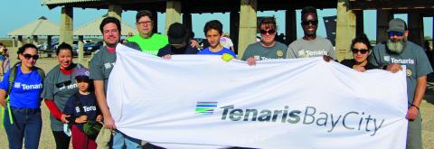 Above, this group of Tenaris employees joins 75 other volunteers flocking to Matagorda Beach for the Texas General Land Office's Adopt-A-Beach spring cleanup, Saturday, April 9. Sentinel photo/Mike Reddell