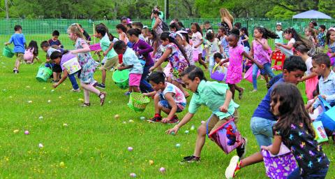 Five year olds make a dash to find prize eggs at this year’s Bay City Parks and Recreation Department annual Easter Egg hunts Friday, April 15. Sentinel photo/Jessica Shepard