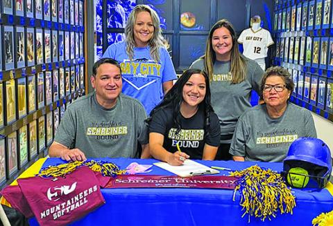 BCISD photo Ladycat softball standout Alyssa Gonzales signed with the Schreiner University Mountaineers in Kerrville on Wednesday, April 27. Alyssa is shown flanked by her parents, Tomas and Rachel Gonzales, and by her coaches behind her, Lindsey May (left) and Head Softball Coach Rilea Sanders. Alyssa lettered four years with the Ladycats and was offensive player of the year in 2020 and All-District Honorable Mention in 2021.