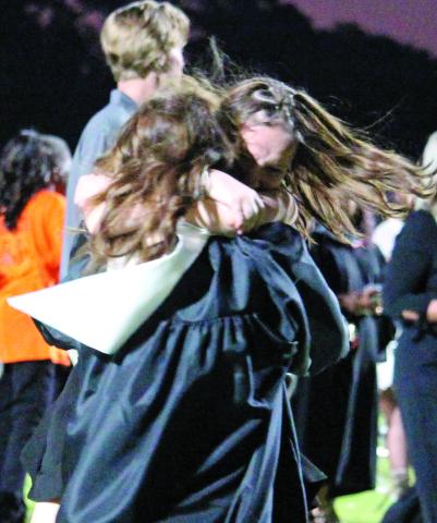 Sentinel photo/Jessica Shepard After their graduation ceremony, the Van Vleck High School class of 2022 shared their excitement with friends and family members in many ways - like this spirited hug Thursday, May 26.