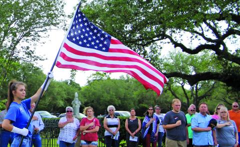 Sentinel photo/Mike Reddell A flag presentation by the Junior Girls Auxiliary for Memorial Day services at Hawley Cemetery including U.S. and Armed Services flags.