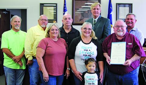 Sentinel photo/Mike Reddell Matagorda County Commissioners Court proclaimed June 2022 as Myuasthenia Gravis  Month at the court’s meeting Monday. Spokesman Simon DeSoto (second from right) said the disease is horrible, where the brain doesn’t communicate with the muscles and afflicts those from the young to the old.
