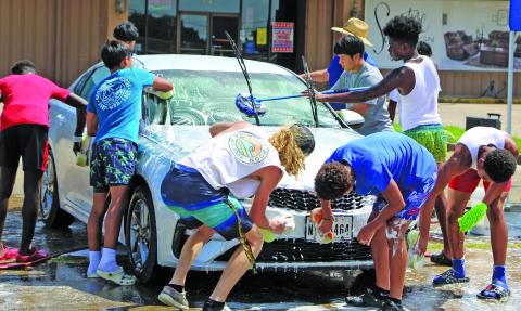 Sentinel photo/Mike Reddell Bay City 7on7 team members put a group touch at a car wash last week to raise money for the boys’ trip to College Station for the state 7on7 tournament June 23-25. Bay City and Tidehaven players both qualified for the state tournament.