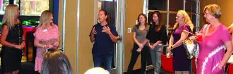 Bay City Sentinel/Mike Reddell Rotary Club President Jessica Russell tells a chamber mixer last week that the club has booked Country Music Artist Chris Cagle for the Aug. 20 Rotary Summer Concert.