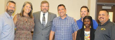 Sentinel photo/Jessica Shepard Newly hired Bay City ISD Superintendent Dr. Dwight McHazlett, Jr. (center left) joins trustees for a photo following their regular meeting Monday, Aug. 1.