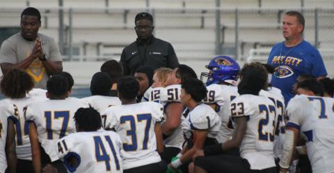 BCISD photo Blackcat coaches talk to players during Victoria East scrimmage.
