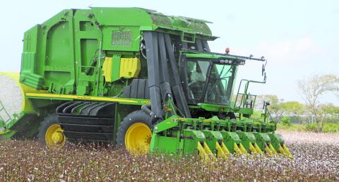 This 6-row cotton harvester was one of many cotton-picking machines working the fields west of the Colorado River last week. This particular field was along FM 1095 between Ashby and Tin Top. Sentinel photo/Mike Reddell