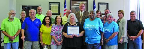 Photo by Stephanie Wurtz Matagorda County HIstorical Commission (MCHC) members are shown with the Commissioners Court, which presented the commission with a Distinguished Service Award from the Texas Historical Commission (at right) at the court’s regular meeting Monday, Aug. 22.