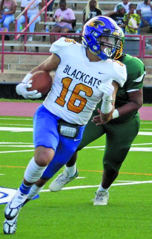 Sentinel Photo/Mike Reddell Bay City wide receiver David Perez (16) looks for more yardage.